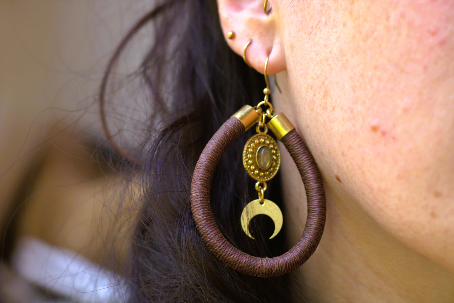 Brown earring with charms
