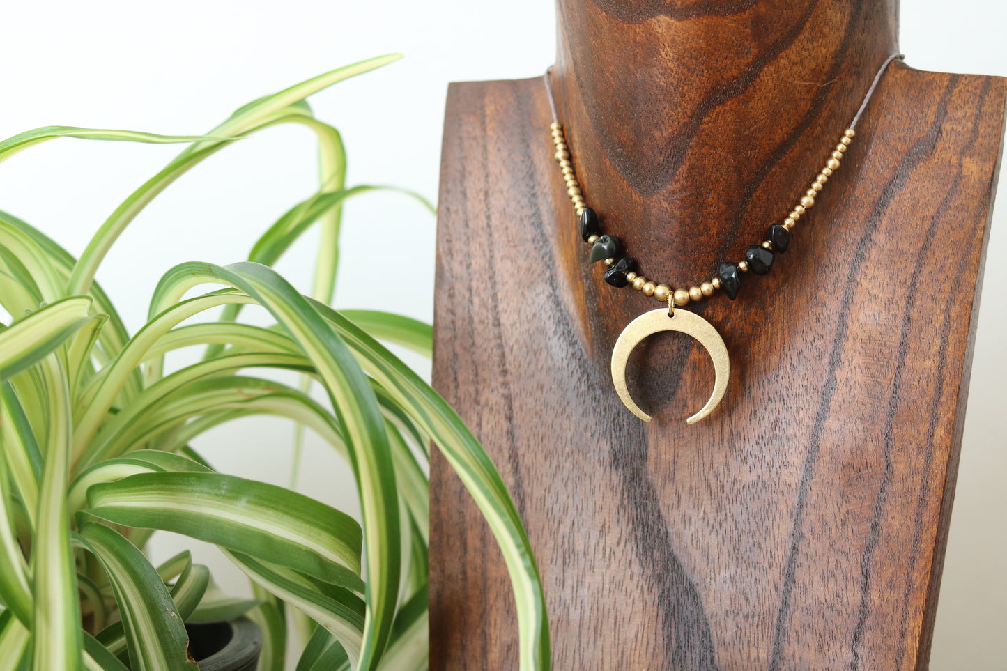 Pendant with stone chip and moon charm