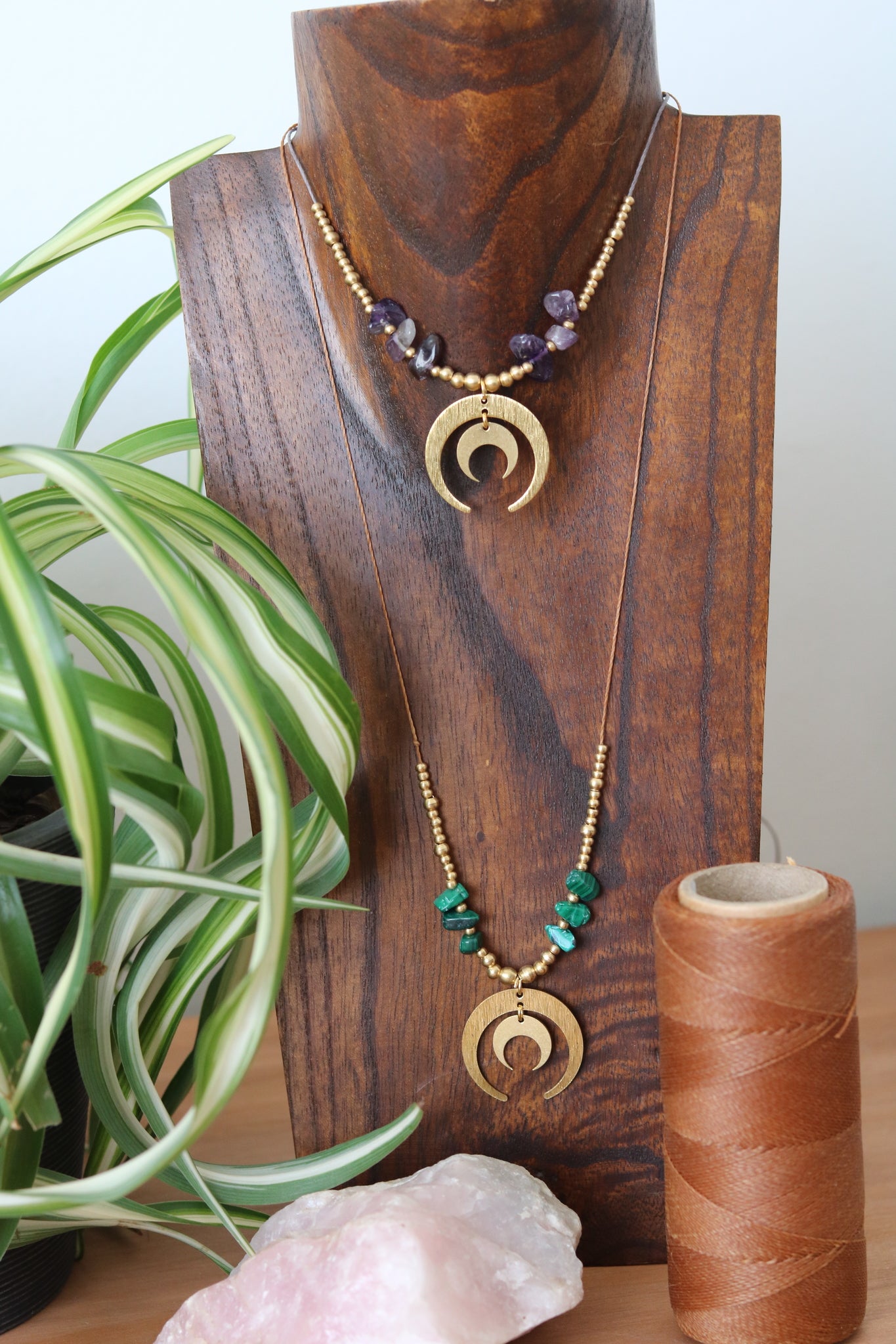 Pendant with stone chip with double moon charm