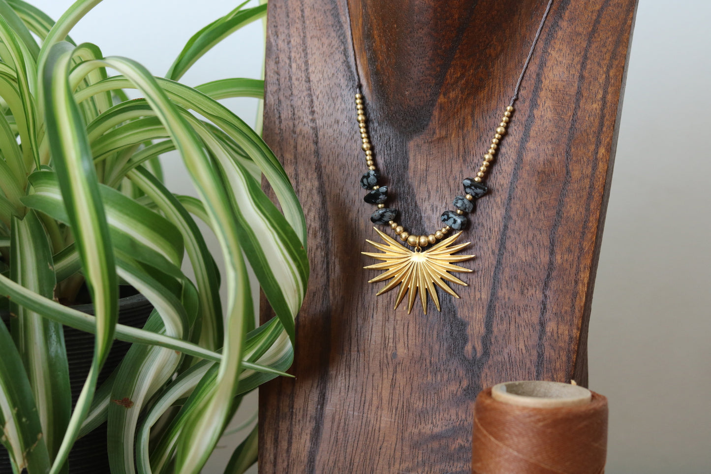 Pendant with stone chip and Sun Charm