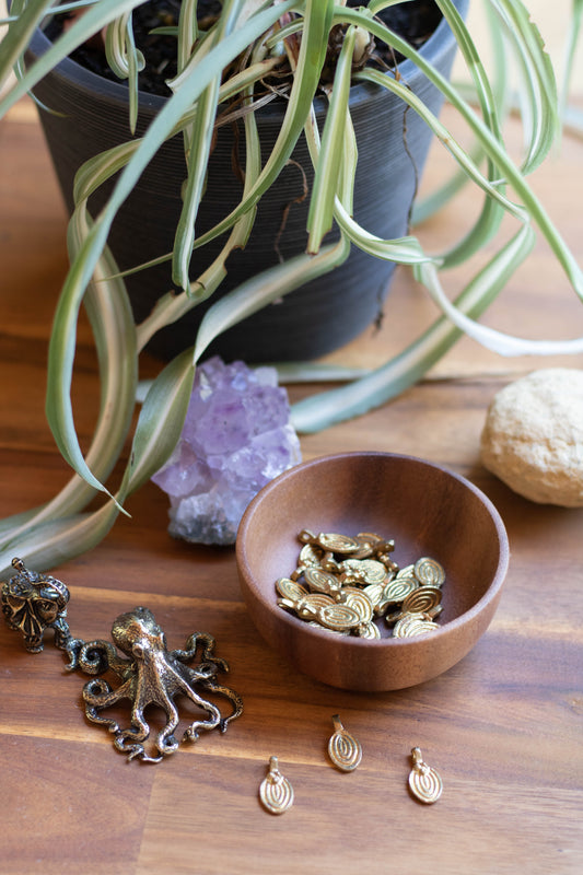 Oval shaped raw brass charms