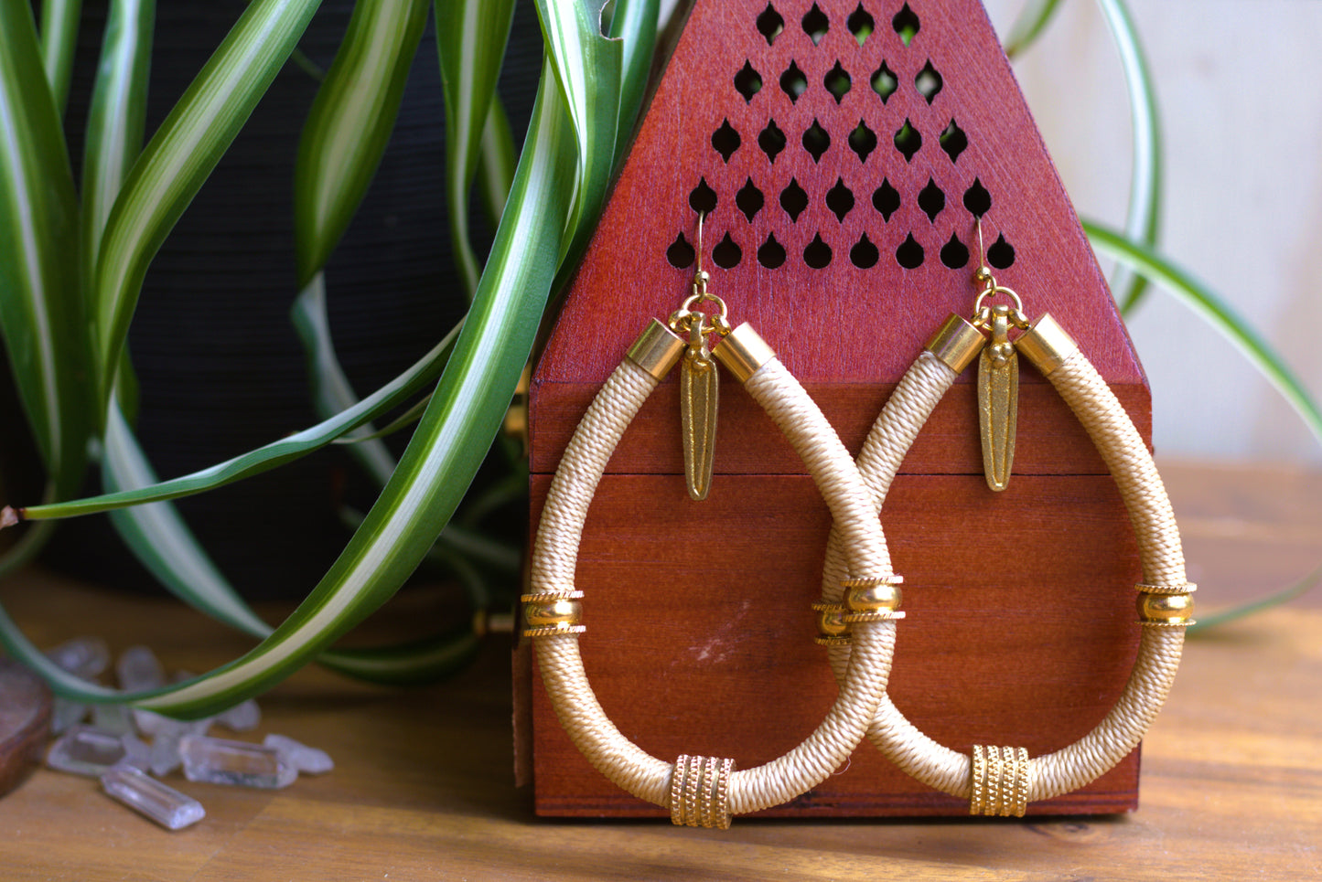 Beige earrings with charm